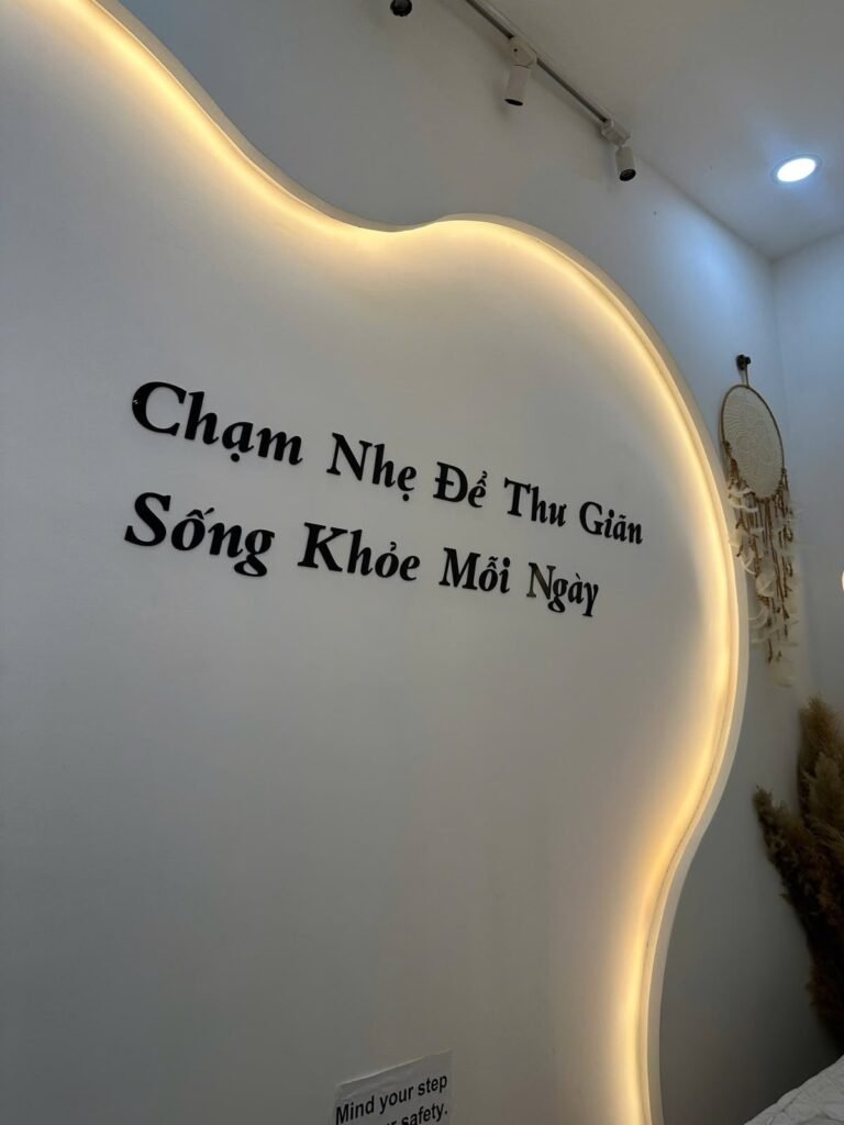 The wall lettering at Chạm Spa reading Chạm Nhẹ Để Thư Giãn, Sống Khỏe Mỗi Ngày